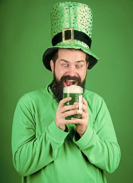 Alcohol beverage. Irish tradition. Man brutal bearded hipster drink beer. Irish pub. Drinking beer part celebration. Fest and holiday menu. Dyed green traditional beer. Lets start patricks party — Stock Photo, Image