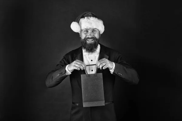Delivering your purchase. Everything you need to fight winter chill. Shopping with pleasure. Bearded man hold shopping bag. Buy new year gifts. Shopping for presents. Discount for club members — Stock Photo, Image