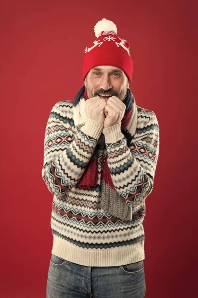 Temperature is below zero. cold weather trends. Winter male fashion collection. Mature man with winter look. Christmas holiday time. having new year mood. frozen bearded man red background — Stock Photo, Image