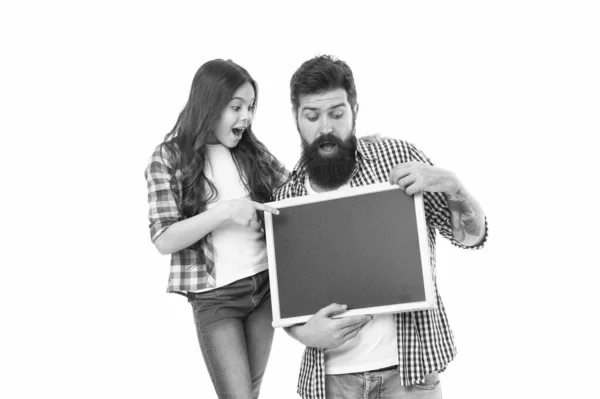 International childrens day. Small girl with dad on white background. Happy childhood. Family news. Awesome news. Advertising or promotion. Father and daughter hold chalkboard copy space. Fathers day — Stock Photo, Image