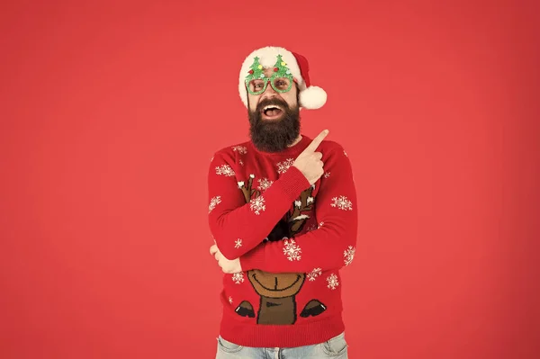 Winter presentation. Hipster bearded man wear winter clothes red background. Christmas celebration ideas. Happy new year celebration. Join holiday celebration. Party outfit. Sweater with deer — Stock Photo, Image