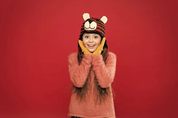 Didnt expect surprise. christmas time. fashion for kids. funny knitwear accessory. small happy girl in knitted hat. cheerful child in gloves wear warm clothes. have fun on winter holiday — Stock Photo, Image