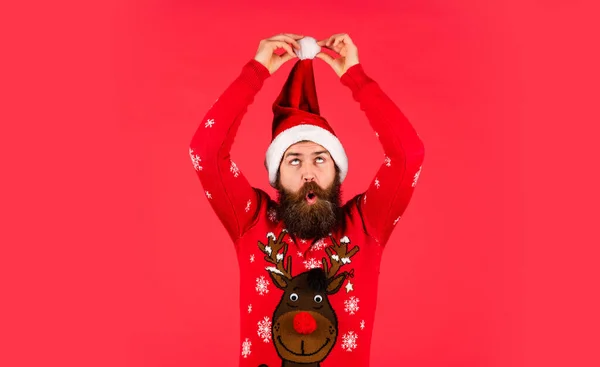 Christmas time. Changes and improvements. Life just got better. Winter holiday fun. Bearded man santa hat. Emotional hipster winter knitted sweater red background. Santa man. New year party — Stock Photo, Image