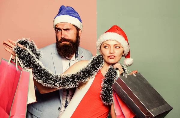 Time for presents. happy new year party. gift with love. time for presents. happy family couple on xmas. santa man and woman with tinsel. christmas shopping sales. winter holidays celebrate together — Stock Photo, Image