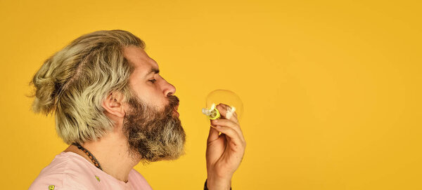 happy hipster in playful mood. Fall into childhood. feeling childish and childlike. real happiness. april fools day. bearded man blowing soap bubbles. carefree man with bubble blower. copy space