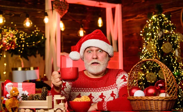 oh god. bearded man eat cookies. winter holiday mood. grandpa drink milk. xmas party celebration. santa have dinner. for santa. christmas composition. ready for new year party