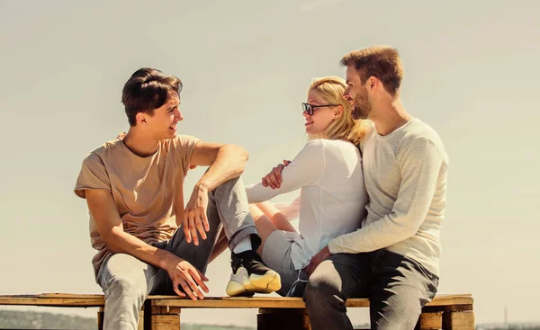Romantic mood. Group of people in casual wear. group of four people. great fit for day off. diverse young people talking together. best friends. Summer vacation. happy men and girl rela