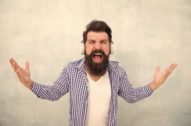 Nothing else matters. Screaming man enjoy favorite song. Music is my life. Hipster wear headphones. Inspired by sound. Enjoy music in wireless headphones. Happy bearded man. Music hobby. Sing with me clipart