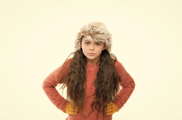 I feel anger. kid fashion. angry little kid isolated on white. ready for winter cold. small girl earflap hat and gloves. her favorite knitted sweater. active healthy childhood. autumn style look — Stock Photo, Image