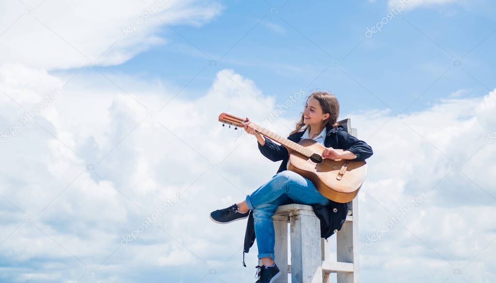 Funky beauty. female singer and guitarist. happy childhood. cute child play guitar outdoor. music and song. vocal school. beautiful teen girl with acoustic guitar. kid country fashion style