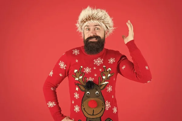 Very little time left. winter holiday activity. warm clothes in cold weather. happy new 2020 year. bearded man on red background. funny man with beard in knitted sweater. funny hipster in earflap hat — Stock Photo, Image