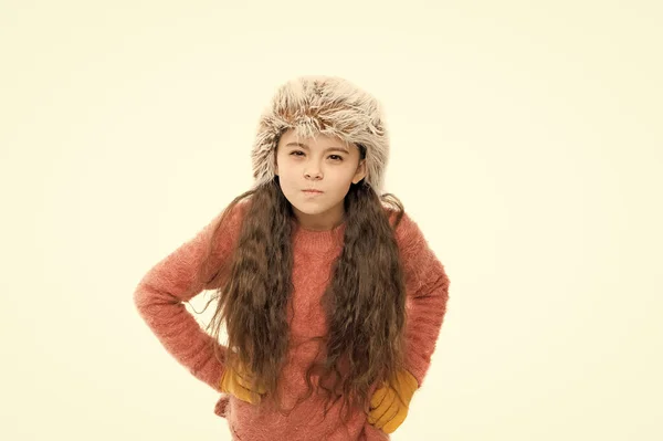 Static and frizz. Adorable child long hair soft fur hat. Child care concept. Girl long hair wear fur hat white background. Winter shampoo and conditioner prevent hair damage. Anti static hair product — Stock Photo, Image