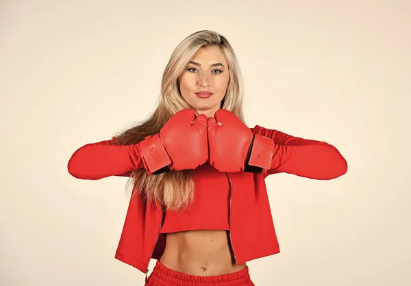 Overcome problems. Personal training. Fight with own complex. Self improvement. Sporty girl red clothes boxing gloves. Gym and workout. Fitness model. Sporty lifestyle. Sporty woman fitness trainer Stock Image