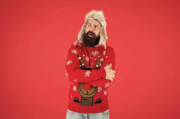 Stay warm in style. Bearded man feel cold red background. Hipster shiver of cold. Festive fashion trends for cold weather. Holiday season. Keeping cold out — Stock Photo, Image