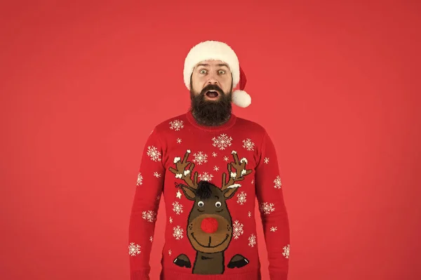 Sweater with deer. Hipster bearded man wear winter sweater and hat red background. Check out my sweater. Happy new year. Join holiday party. Winter party outfit. Invitation ugly sweaters party — Stock Photo, Image