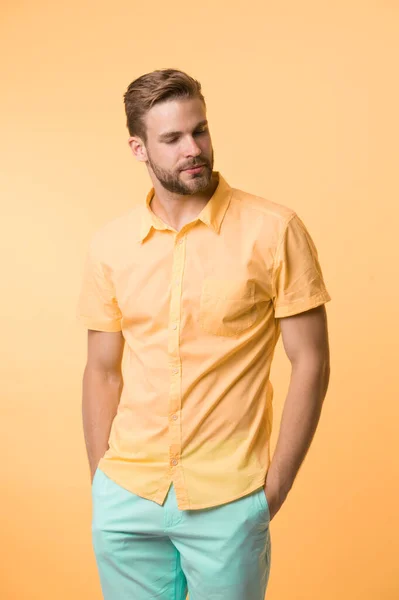 Casual style. Man on calm face posing confidently put hands pockets. Man attractive in casual shirt. Guy fashion model wear casual shirt. Feel comfortable in simple outfit. Casual comfortable outfit