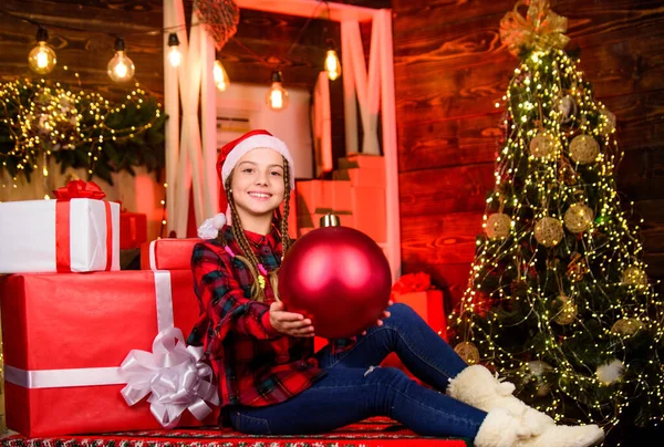 Red style. Spread love. Winter holiday. Small cute girl with big ball christmas tree. Christmas spirit. Decor shop. Favorite color. Christmas concept. Child fancy santa enjoy celebration new year — Stock Photo, Image