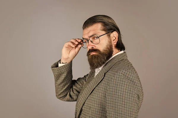 Ambitious formal fashion model. handsome man standing on gray background. serious bearded businessman. stylish mature man looking modern. mens jacket wardrobe. fashionable man wear glasses — Stock Photo, Image