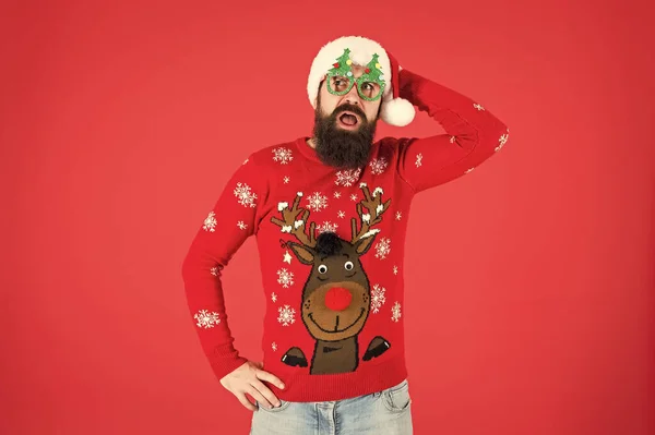 Knitted sweater. Happy new year. Christmas spirit. Winter party outfit. Sweater with deer. Clothes shop. Buy festive clothing. Holidays accessories. Hipster bearded man wear winter sweater and hat — Stock Photo, Image