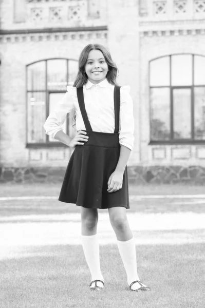 Meet school year. Happy childrens day. Elegant look of schoolgirl. Kid in uniform. Pupil in vintage outfit. Back to school. Happy kid fashion and shopping. Education and knowledge. Going to school