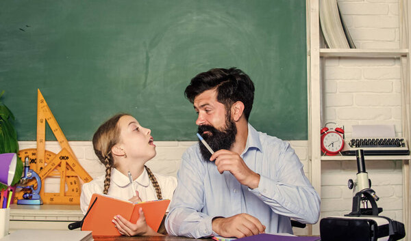 Find buddy to help you study. Private lesson. School teacher and schoolgirl. Pedagogue skills. Talented pedagogue. Work together to accomplish more. Man bearded pedagogue. Homeschooling with father
