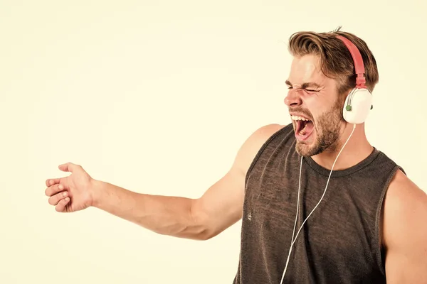 Start this party. Man handsome dj using modern headphones. Professional musical software and devices. Cheerful dj full of energy. Entertainment concept. Music drives him dance. Equipment for dj Stock Photo
