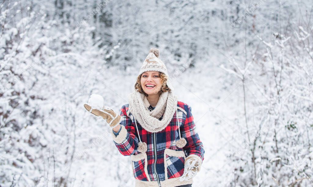 Walk in snowy forest. Cheerful emotional girl having fun outdoors. Winter outfit. Woman wear warm accessories stand in snowy nature. Winter fashion collection. Winter admirer. Favorite season