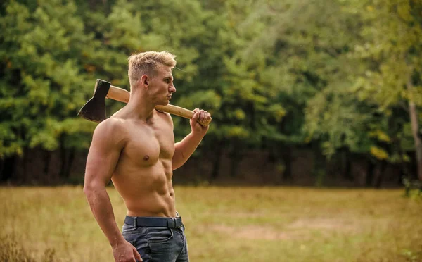 Forester with axe. Sexy macho bare torso. Surviving in wild nature. Muscular athlete in forest. Sport and fitness. Muscular body. Strength and power concept. Handsome shirtless man muscular body — Stock Photo, Image