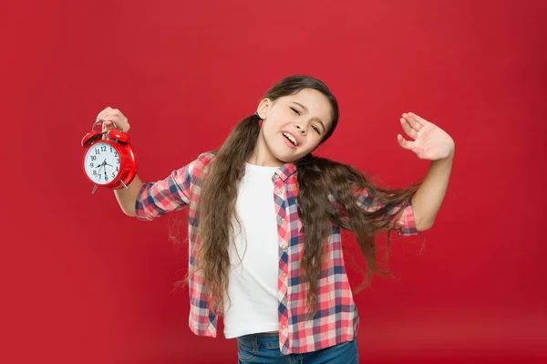 Sleepy teen girl hold retro alarm clock, awakening — Stock Photo, Image