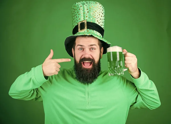Drinking beer part celebration. Fest and holiday menu. Dyed green traditional beer. Lets start patricks party. Alcohol beverage. Irish tradition. Man brutal bearded hipster drink beer. Irish pub — Stock Photo, Image