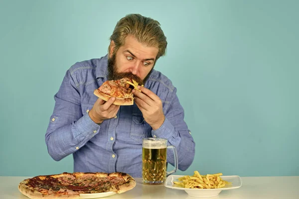 American pub menu. man watching football while drinking beer with pizza and french fries. eating pizza and drink. Best party here. bachelor men club. drink in bar — Stock Photo, Image