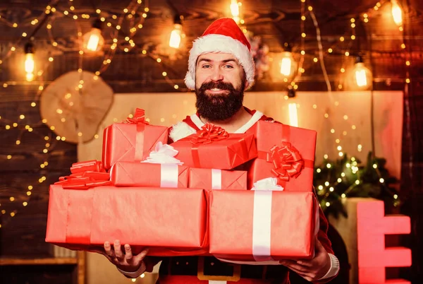 Man bearded santa celebrate christmas with presents. May your home be filled with all joys of season. New year celebration. Santa claus hold many gifts. Celebrate with joy. Celebrate winter holidays — Stock Photo, Image