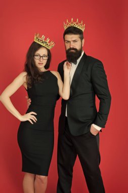 Perfect match. Elite society. Being recognised and proud. Proud couple. Woman and bearded man wear crowns. Selfish egoist. Superiority complex. Fame and popularity. Famous couple. Proud of their love clipart