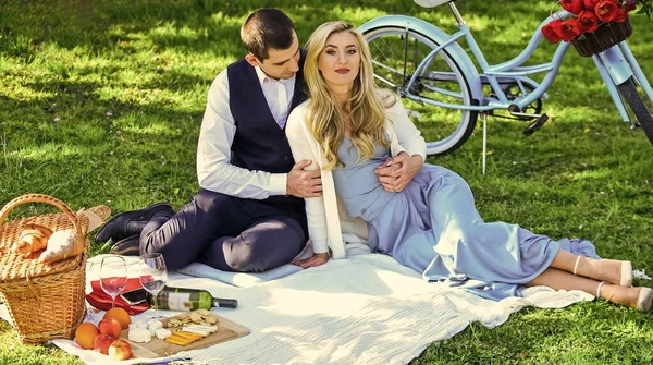 Love time. family relationship and friendship. nice summer holiday. girl and man travel on vintage bike. couple in love drink wine during romantic dinner in park. romantic picnic of couple in love