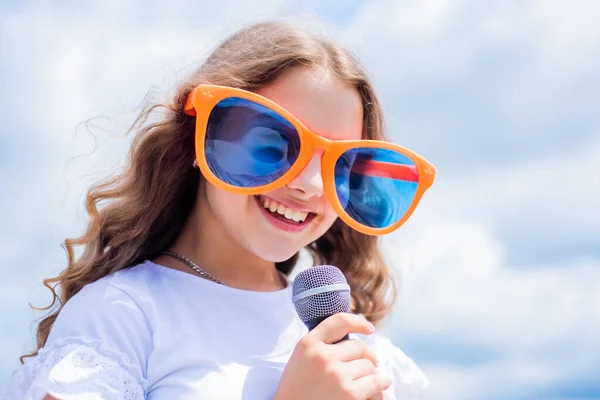 Cheerful child singer singing in microphone music style, vocal — Stock Photo, Image