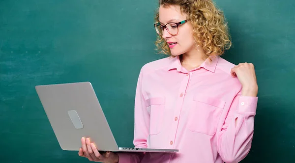 Teaching online course. Remote job. Online schooling concept. Woman laptop surfing internet. Informatics and programming. Teacher notebook searching information chalkboard background. Online school