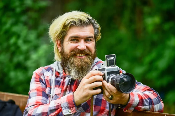 Real joy. bearded man hipster take photo. photo shooting outdoor. brutal man traveler with retro camera. photography in modern life. travel tips. professional photographer use vintage camera — Stock Photo, Image