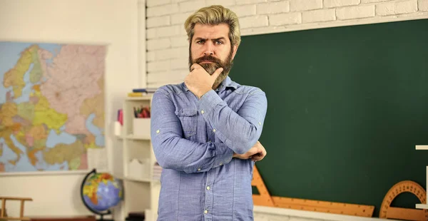 Private lesson. Back to school. Study with interest. Man mentoring school projects. School subject. Basic education. History and geography. Science concept. Mature bearded teacher in classroom