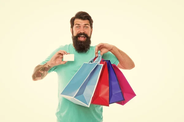 Happy man shopping. Payment method. Bank card. Black friday sale. Satisfied customer. Easier than ever. Contactless payment. Credit card. Bearded man with bags and discount card. Purchase concept — Stock Photo, Image