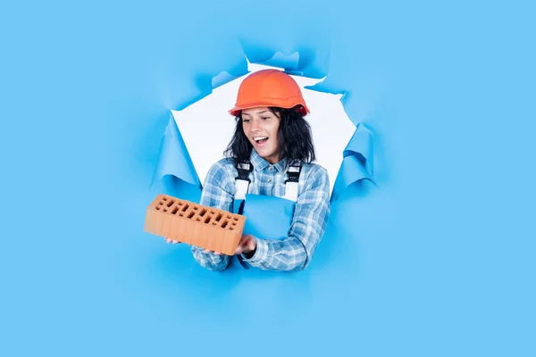 Build your future yourself. female worker in working uniform. cheerful woman wear safety helmet. girl carpenter use brick. happy beautiful lady engineer. builder assistant repair and fix