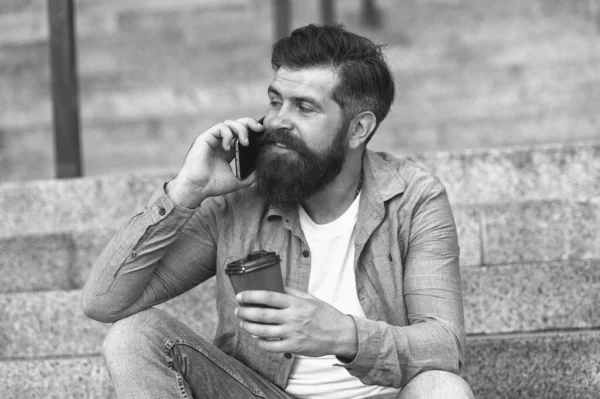 Glad to hear. Hi dear. Modern urban life. Bearded man phone conversation. Mobile conversation. Personal communication. Calling friend. Pleasant conversation. Real connect. Drink coffee while talking — Stock Photo, Image