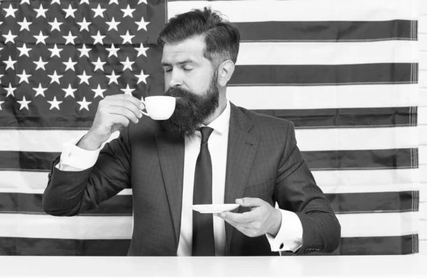 Choose liberty. politician drink coffee. Bearded businessman patriotic for usa. happy national holiday. USA celebrate 4th of July. English language learning. Businessman with American flag and coffee