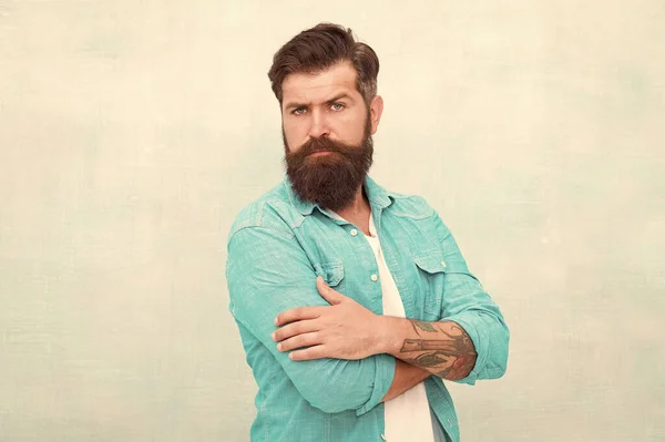 Denim fashion trends. Barbershop fashion. Charismatic barber with beard and mustache. Personality and character. Charisma concept. Bearded well groomed hipster. Good looking guy wear fashion clothes