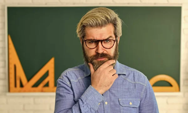 Talented pedagogue. Study in college. Mature bearded teacher in glasses. Education concept. Private lesson. Back to school. Man teacher mentoring school projects. Science modern school. Math subject