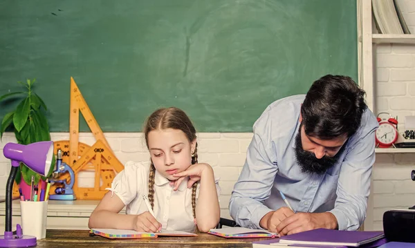 Early development of children. daughter study with father. Teachers day. education child development. knowledge day. Home schooling. back to school. bearded man teacher with small girl in classroom — Stock Photo, Image