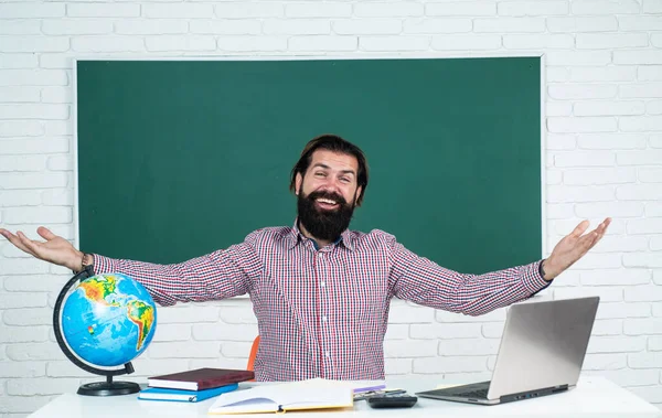 please, welcome. knowledge day. mature bearded teacher at lesson. brutal man work in classroom with blackboard. prepare for exam. college lecturer on lesson. back to school. formal education