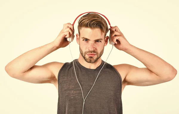 Listen music for motivation and inspiration. Audio quality. Modern earphones concept. Audio education. Audio track. Man handsome unshaven hipster listening audio file using headphones gadget