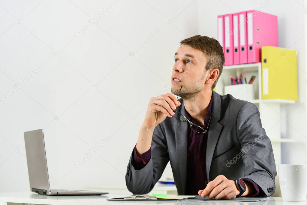 Busy man in modern workplace. boss or employee. being professional secretary. skilled and successful ceo. young businessman working in office. male manager work on laptop. copy space