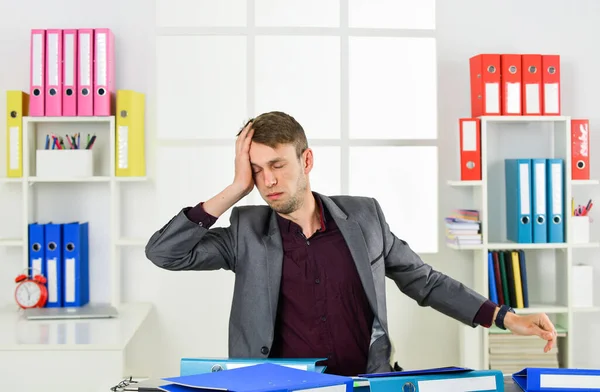 so exhausted. man wear office suit. male realtor has hard working day. online courses tutor. leader of law office. tired lawyer working with computer. agile business. businessman making notes