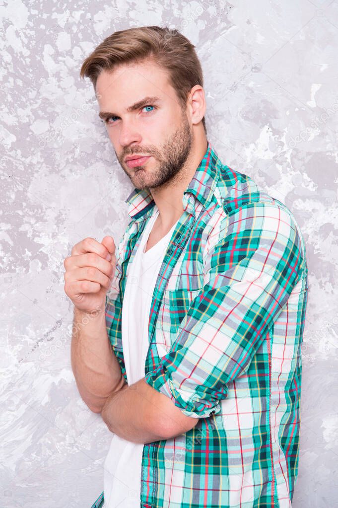 thoughtful guy checkered shirt. good looking unshaven man. concept. mens sensuality. bristle barber shop. sexy guy casual style. macho man grunge background. male fashion model. Stylish and sexy